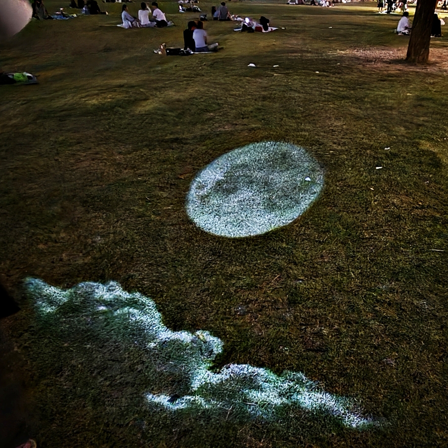 Projecting Saturn at the Han River at night
