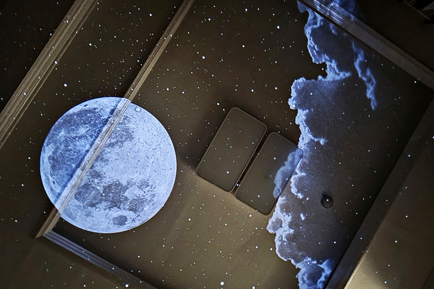 Moon projection on a bedroom ceiling
