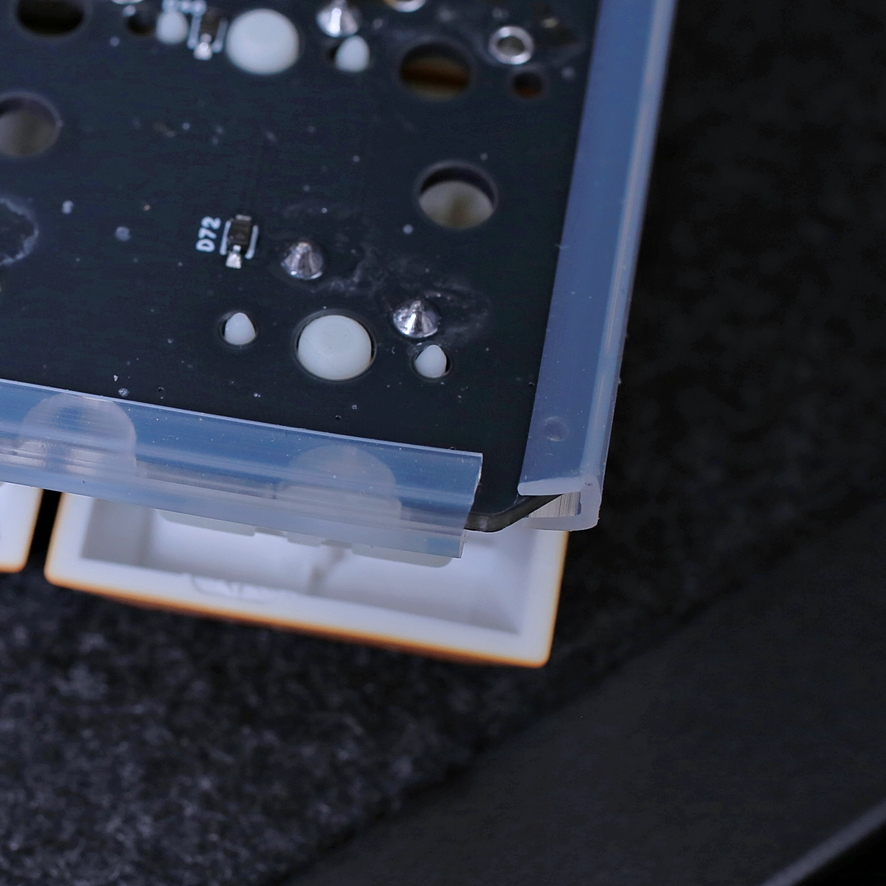 Closeup of silicone channel fitted on PCB edge