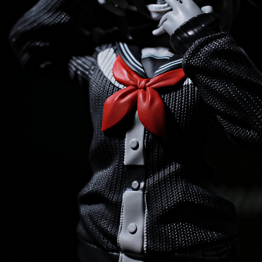 Red sailor uniform ribbon accent on monochrome Toga figure