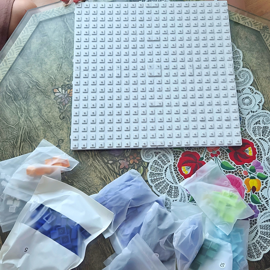 Child and parent assembling baseplate stems together