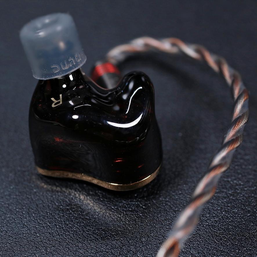 DUNU PRS5 earphone resting in hand
