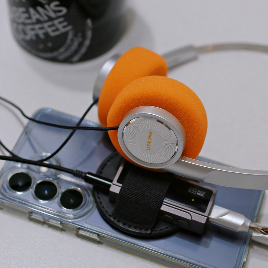 Headphones worn around neck like a fashion accessory